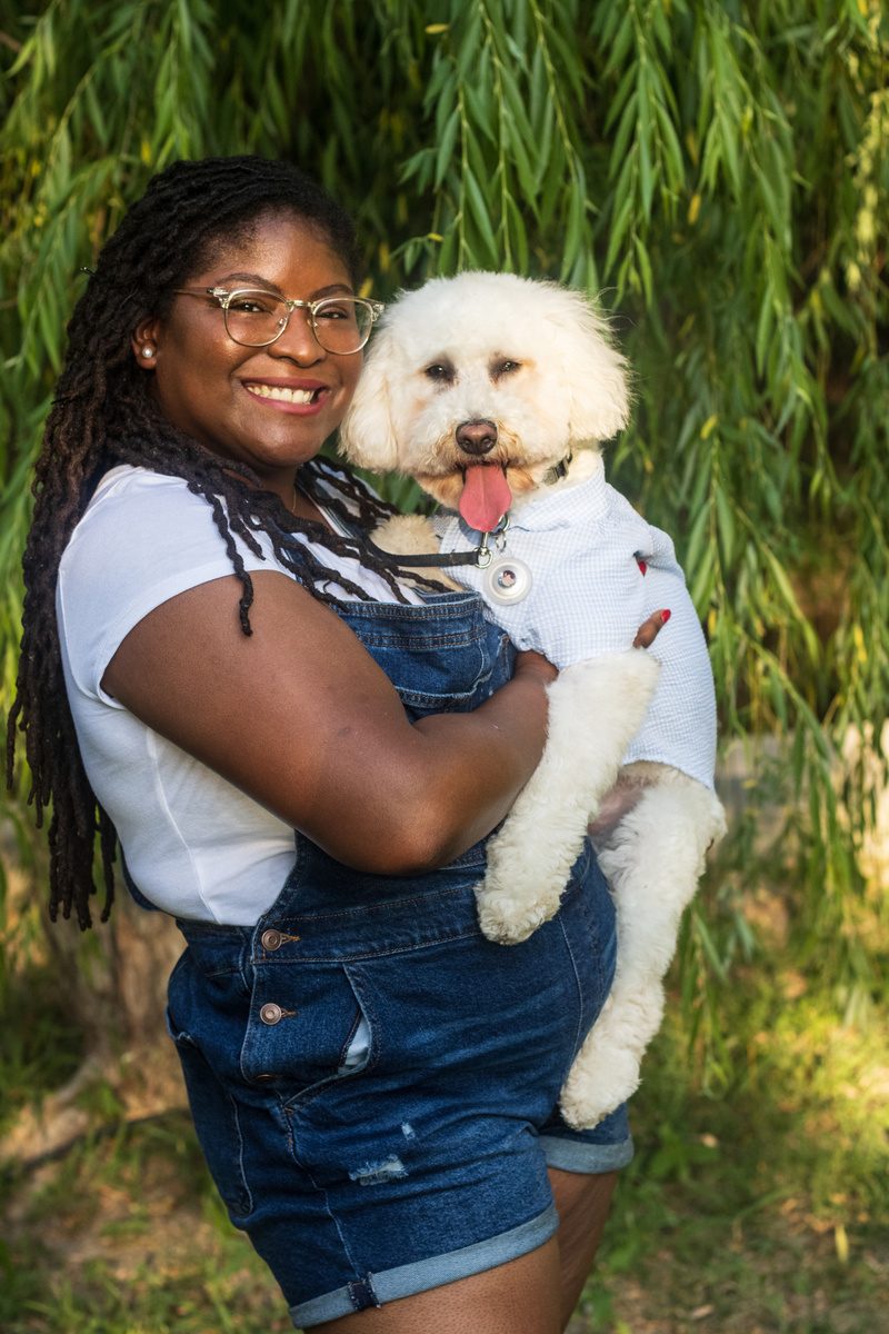 Dr. Christiana Redeaux holding her dog, Frankie
